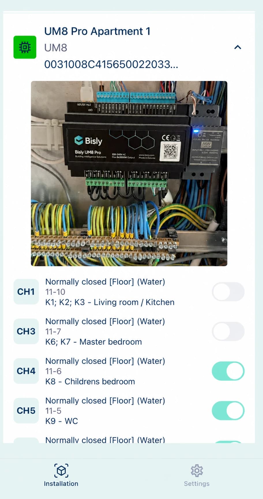 Bisly Installer App beside a photographed controller panel